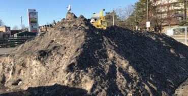 A pile of snow covered in dirt
