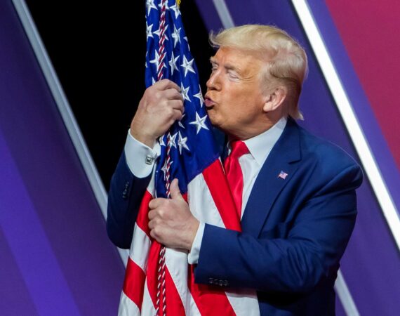 Donald Trump kissing an American flag