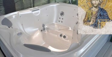 image of a modern jacuzzi with an inset of a tile mosaic of Jesus in the upper right corner