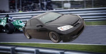 A beat-up 2005 Honda Civic on a racetrack, in front of a standard race car.