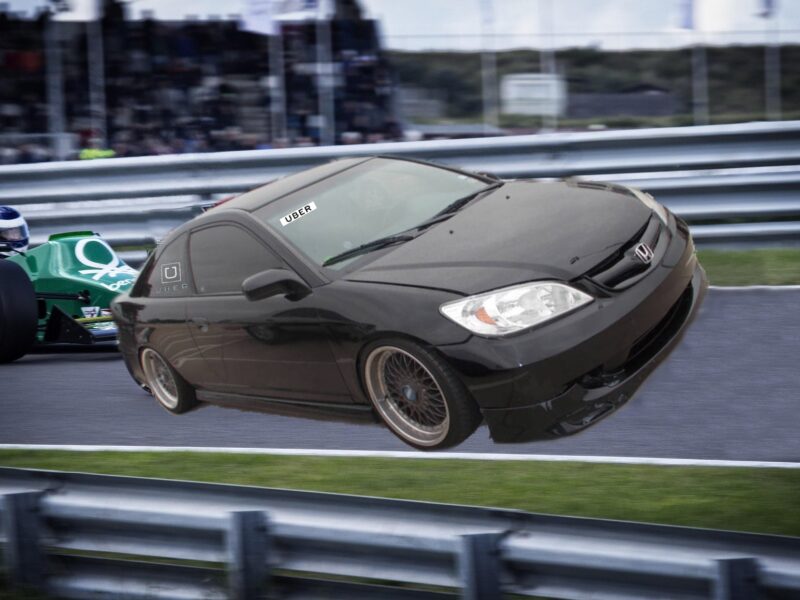 A beat-up 2005 Honda Civic on a racetrack, in front of a standard race car.